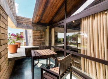 Tables arranged in the seating areas of the villas